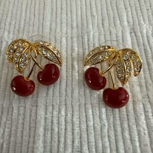 Joan Rivers (JR) signed cherry earrings.
